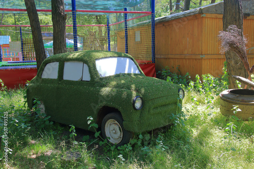 An old abandoned car with a funny tuning. photo