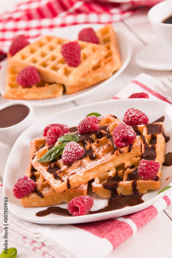 Waffles with raspberries and chocolate cream. Waffles with raspberries and chocolate cream.