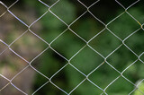 Mesh netting close-up on a background of green grass.