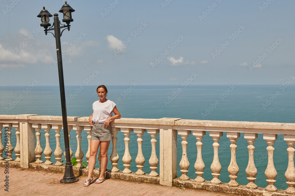 one girl stands on the embankment in Batumi one girl stands on the embankment in Batumi