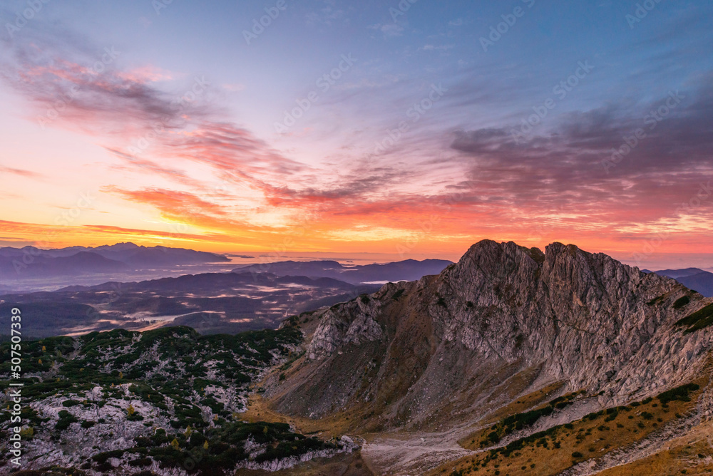 Sunrise in the mountains. Early morning as viewed from the top of Visevnik hill with vast landscape below.