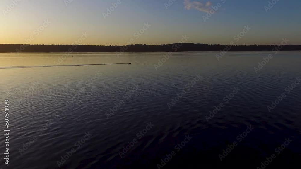 Aerial shot of a beautiful sunset over Starnbergersee with Alps in background in Bayern, Germany
