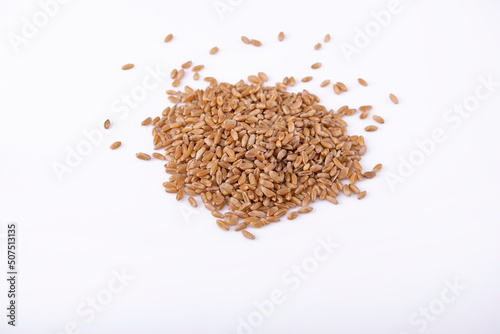 Top view of a heap of wheat on white table