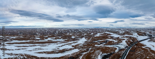 Photos Aerial video of an empty lava fields and huge volcanic mountain covered in ice near Snaefellsjokull in the distance, Iceland