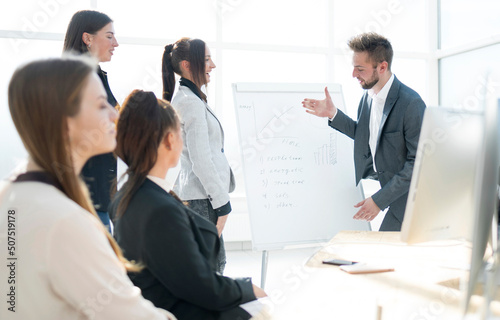 Manager and staff discussing a new presentation.