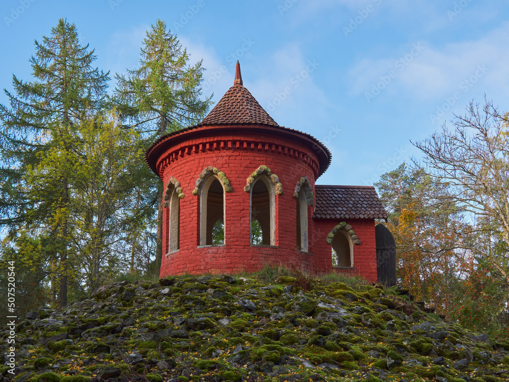 Temple of Happiness in Aulanko nature reserve and recreation area in Finnish Hameenlinna city built for the Polish Empress: autumn, blue sky, colorful trees.