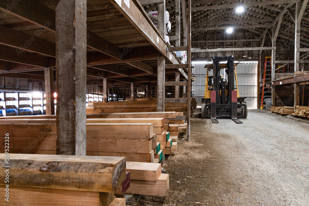 Small town lumberyard with stacks of timber and wood n historical building Stock Photo Adobe Stock