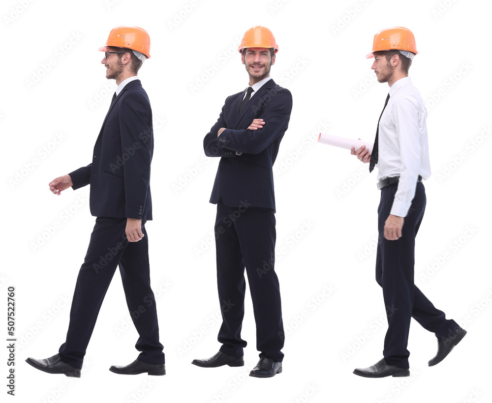 in full growth .a qualified architect in an orange helmet in full growth .a qualified architect in an orange helmet
