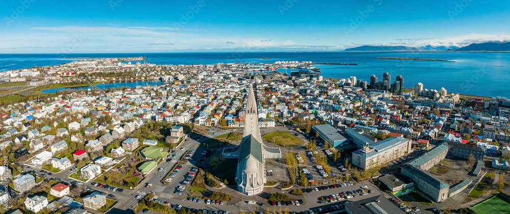 Aerial view of the Hallgrimskirkja Church in Reykjavik. Scenic view of Iceland in 4k. Hallgrimskirkja Lutheran Church. Statue of Leif Eriksson.