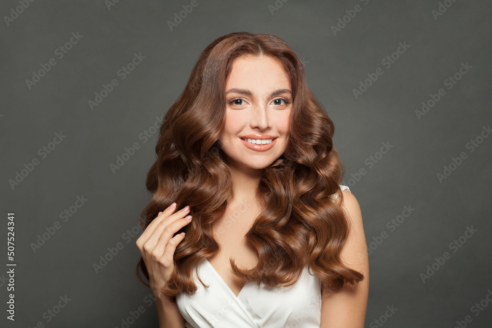 Portrait of a woman with curly hair. Haircut. Shine and hair care Portrait of a woman with curly hair. Haircut. Shine and hair care