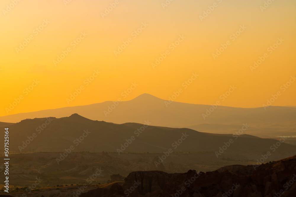 Quote background concept photo. silhouette of mountains or hills at sunset