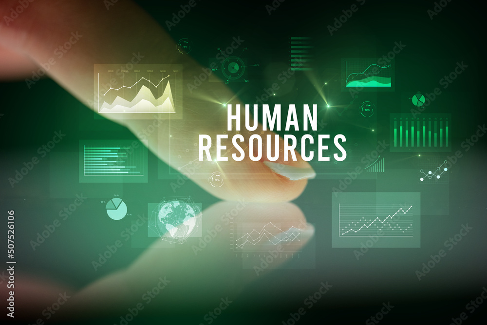 Finger touching tablet with business graphs and icons concept Finger touching tablet with business graphs and icons concept