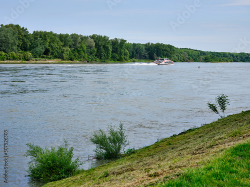 Canvas Print Distant Twin City Liner passenger catamaran cruising along the Danube River besi