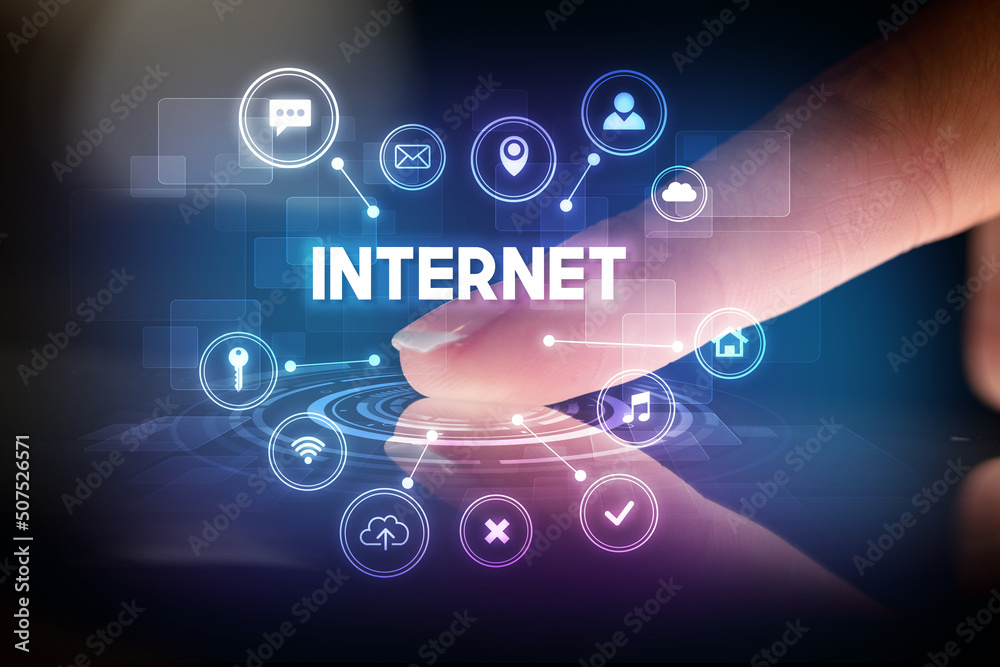 Finger touching tablet with web technology icons concept Finger touching tablet with web technology icons concept