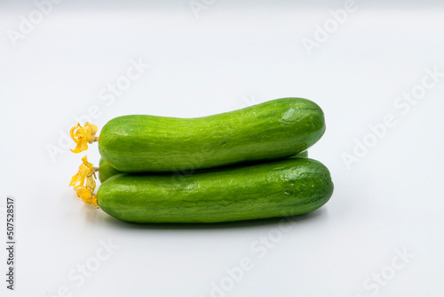 Select focused cucumbers on an isolated white background Cucumbers top view, food background. Macro Photo food cucumbers. Texture pattern background green cucumbers. Image fresh green cucumbers.