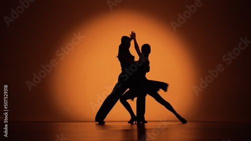 Tableau sur toile Couple of dancers approach each other and begin to dance Argentine tango