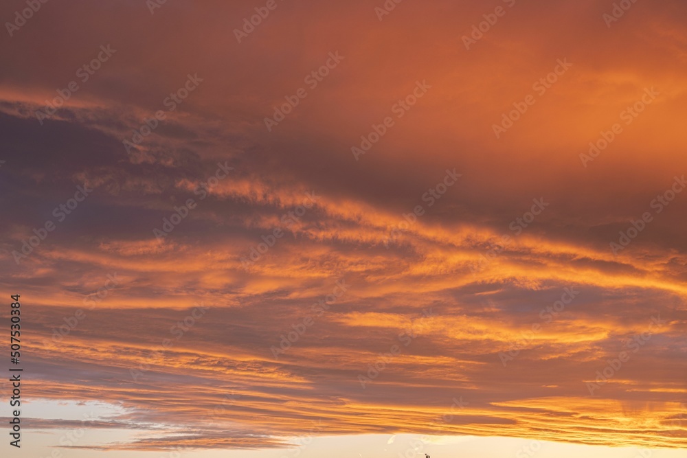Orange glowing cloud formation during sunset
