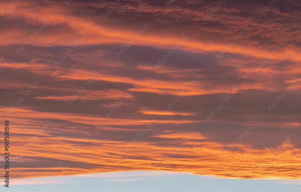 Orange glowing cloud formation during sunset