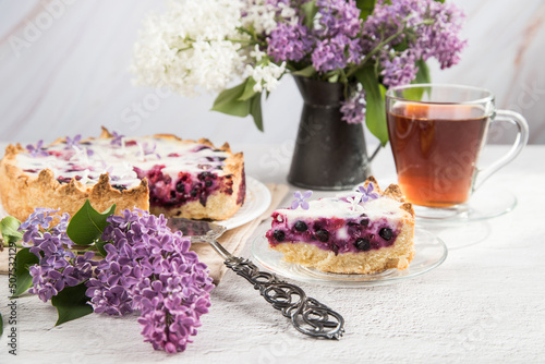 Close-up of a homemade pie with black currant berries.