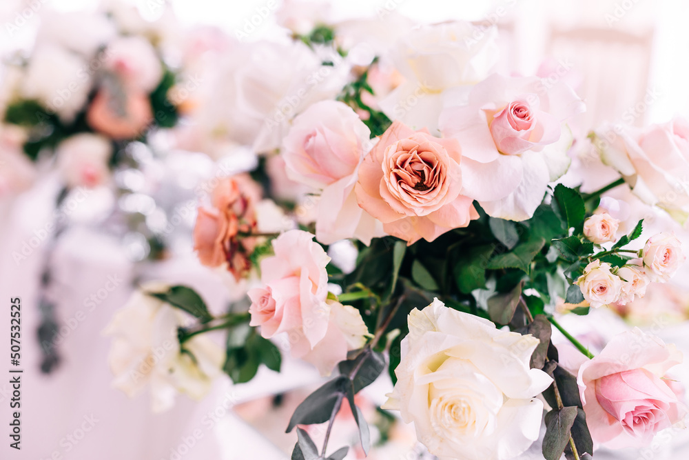 Wedding decoration table in the hall, floral arrangement. In the style vintage. Decorated dining table with flowers for guests and newlyweds, in peach-pink, pastel color. Wedding decoration table in the hall, floral arrangement. In the style vintage. Decorated dining table with flowers for guests and newlyweds, in peach-pink, pastel color.