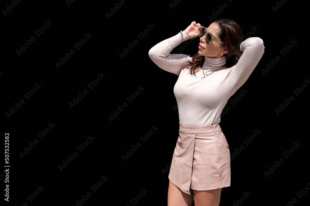 .Casual young woman on black background. advertising space .Casual young woman on black background. advertising space