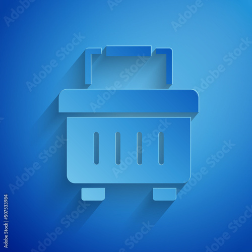 Paper cut Toolbox icon isolated on blue background. Tool box sign. Paper art style. Vector