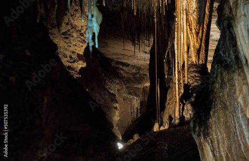 Deep cave opening showing lots of formations like stalactites, stalagmites and columns some thousands of years old and extremely delicate.