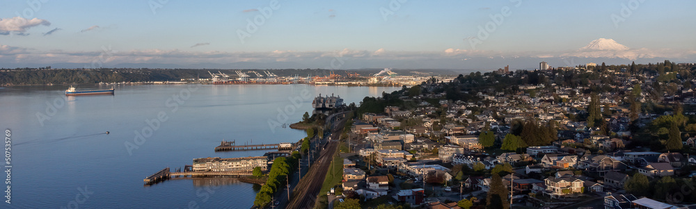 Aerial drone view of Tacoma's Old Town neighborhood, Commencement Bay, Port of Tacoma and Mount Rainier.