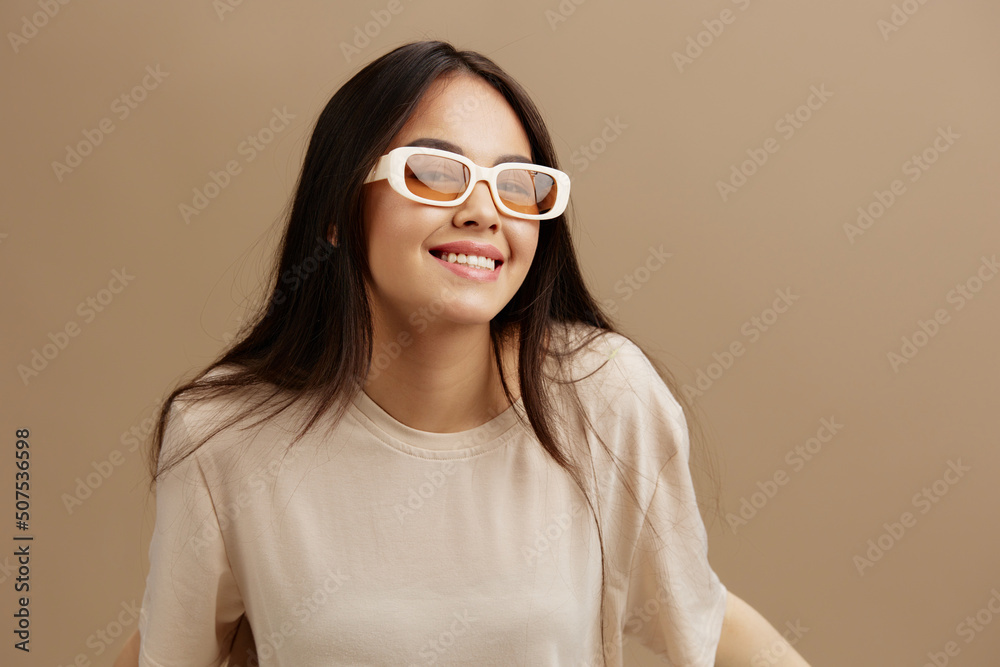 woman attractive look charmin dark glasses in a t-shirt isolated background