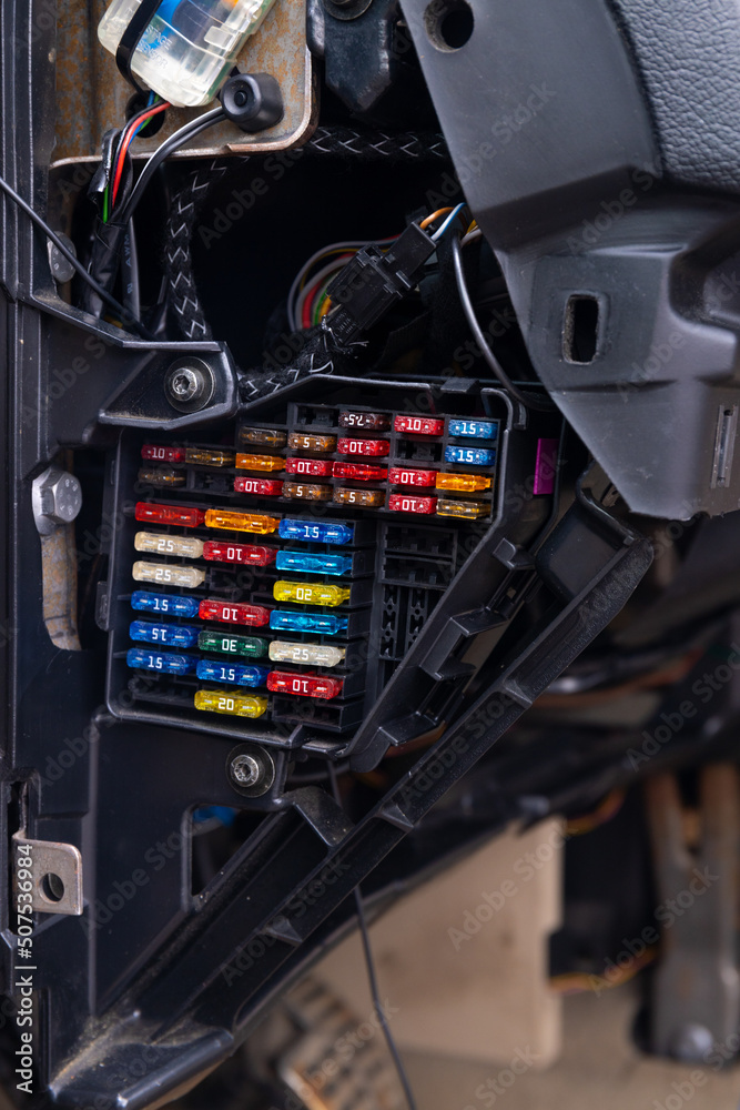 Detail of a car engine bay with fuses. Focus of Car Fuse box. fuses in