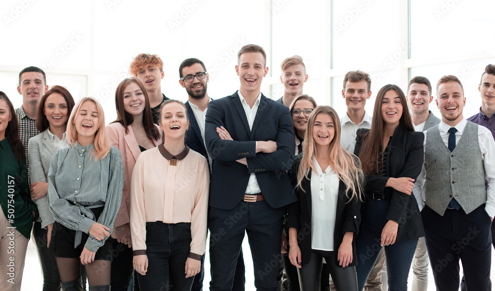 Fototapeta premium happy group of young employees with hands up