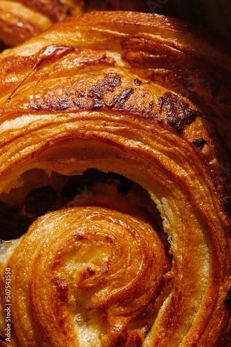 Close up texture of Pain aux raisins or Dutch 'koffiebroodje' (translation: coffee roll) photo