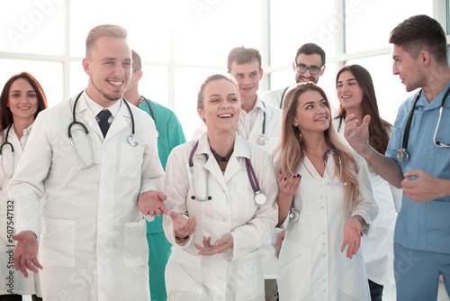 close up. cheerful medical professionals in the office corridor