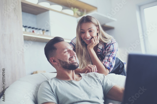 close up. young couple looking at laptop screen.