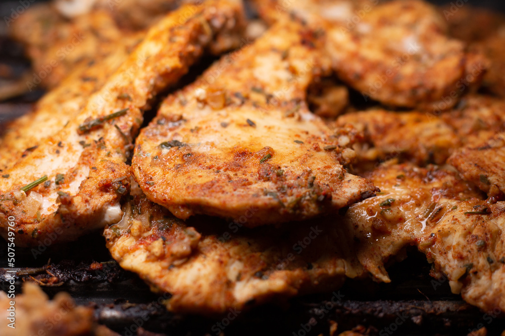 delicious grilled chicken fillet on the grill