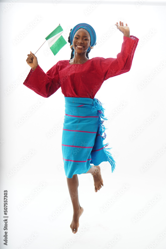 Portrait of happy Nigerian waving the national flag Portrait of happy Nigerian waving the national flag