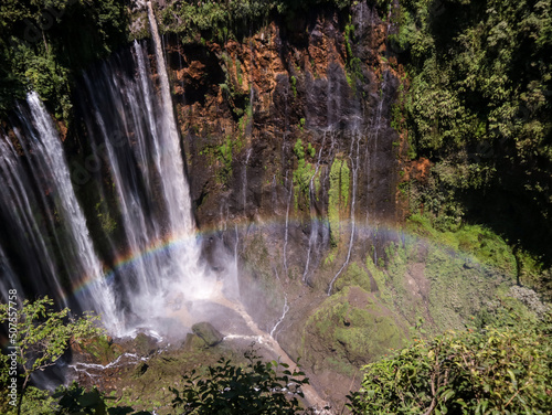 waterfall in the middle of the forest and rainbow. Lumajang  Indonesia.