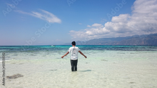 Standing and enjoying the beautiful view of the beach on Alor Island. The natural scenery is very stunning.