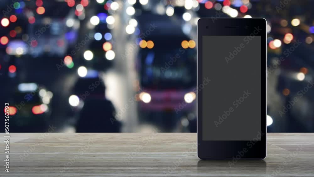 24 hours service flat icon on modern smart mobile phone screen on wooden table over blur colorful night light traffic jam road in city with cars, Business full time online service concept 24 hours service flat icon on modern smart mobile phone screen on wooden table over blur colorful night light traffic jam road in city with cars, Business full time online service concept