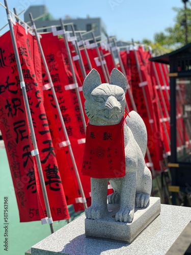 Fox guardian, messenger of God, at the shrine of temple Japan, Fukagawa Fudodo, Tokyo Japan year 2022 May 29th photo