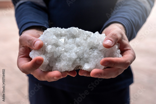 Принти на полотні The person is holding some colemanite mineral (bor, boron, borax, ulexite)