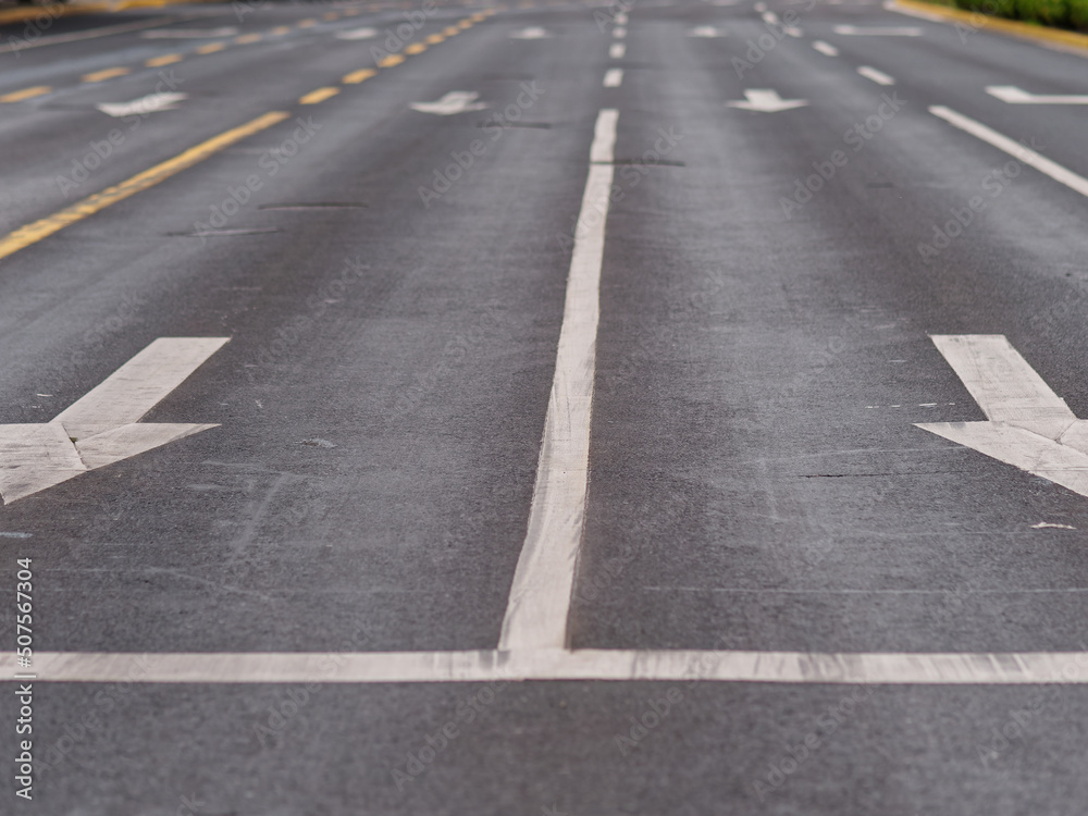 Two arrow marking signs on empty road, no traffic during Shanghai lockdown.