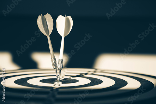 Bullseye target goal or dartboard has dart arrow throw hitting center shooting for financial business targeting planning to winner concept.