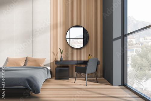 Fotografija Modern hotel studio interior with bed, dressing table and panoramic window