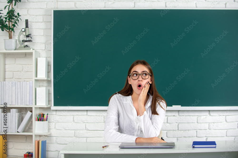 High school surprised student in classroom. Amazed school girl. High school surprised student in classroom. Amazed school girl.