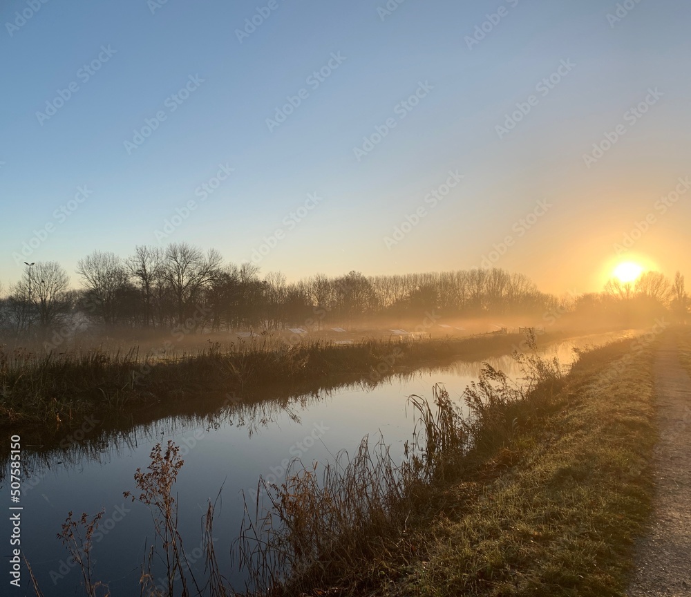 Fototapeta premium Sunrise with canal reflection