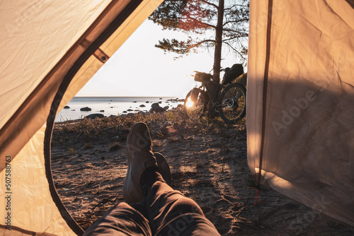 Cyclist's camp by the sea