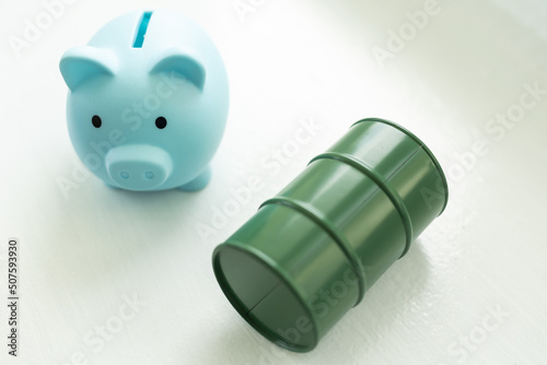 pig piggy bank and toy barrel of fuel