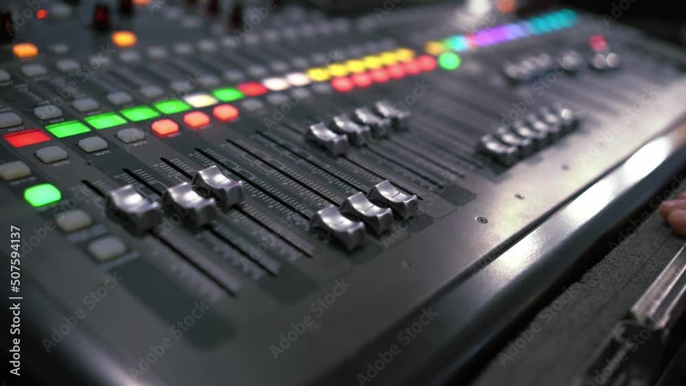 Professional audio mixing console. Mixer. Pro audio mixing board faders and knobs. Static shot of multi-track music recording equipment faders and sliders. Professional audio mixing console. Mixer. Pro audio mixing board faders and knobs. Static shot of multi-track music recording equipment faders and sliders.