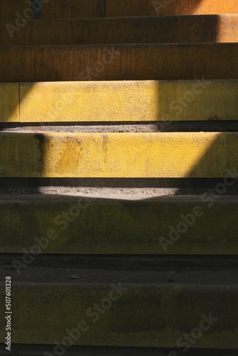 Industrial stairs in bright safety yellow.